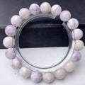 A purple turquoise bead bracelet for women showing round stone beads on a wrist.