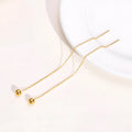 Gold-tone minimalist drop earrings made of alloy with small golden beads for women