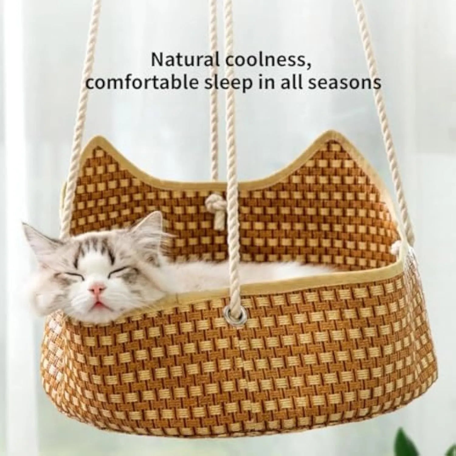 Green rattan cat hammock with cotton ropes and metal hooks, shown hanging