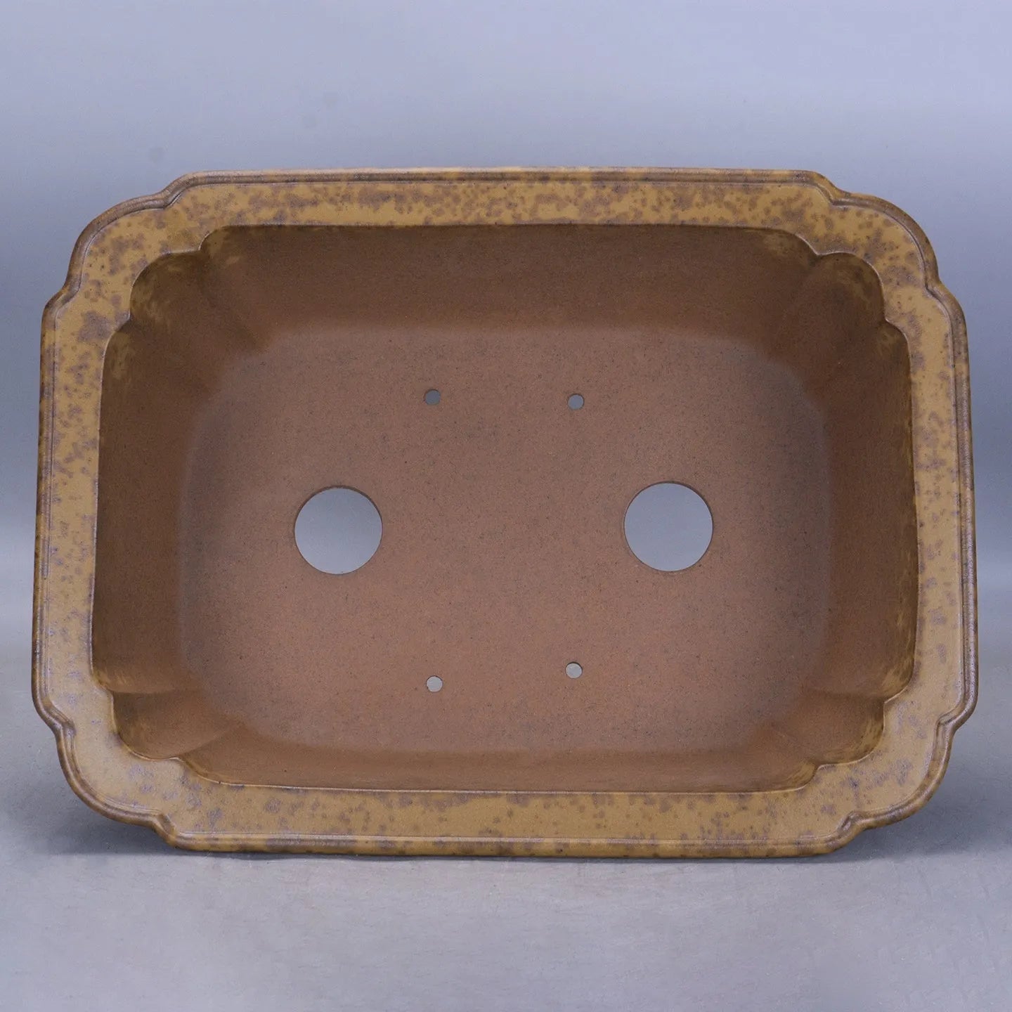 Large rectangular purple sand flowerpot with a double pumping angle design, shown on a floor.