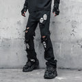 Black cotton denim jeans with skull and crossbones distressed design, mid waist, fit flared horn trousers for men.