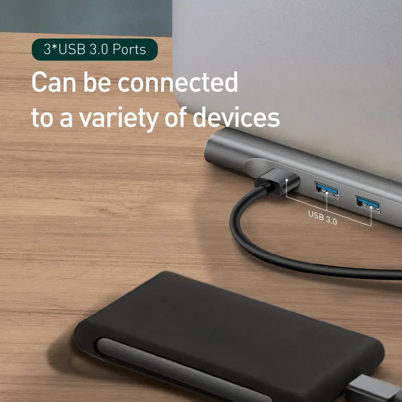 Grey aluminium alloy USB-C hub with cooling bracket showing ten ports including HDMI, VGA, Ethernet and USB