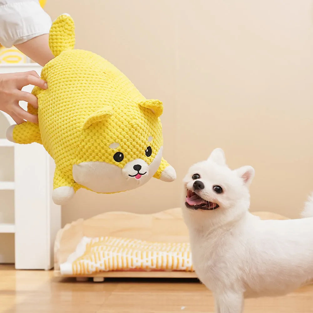 Plush calming dog toy with squeaker for chewing and anxiety relief, shown in large and medium sizes.