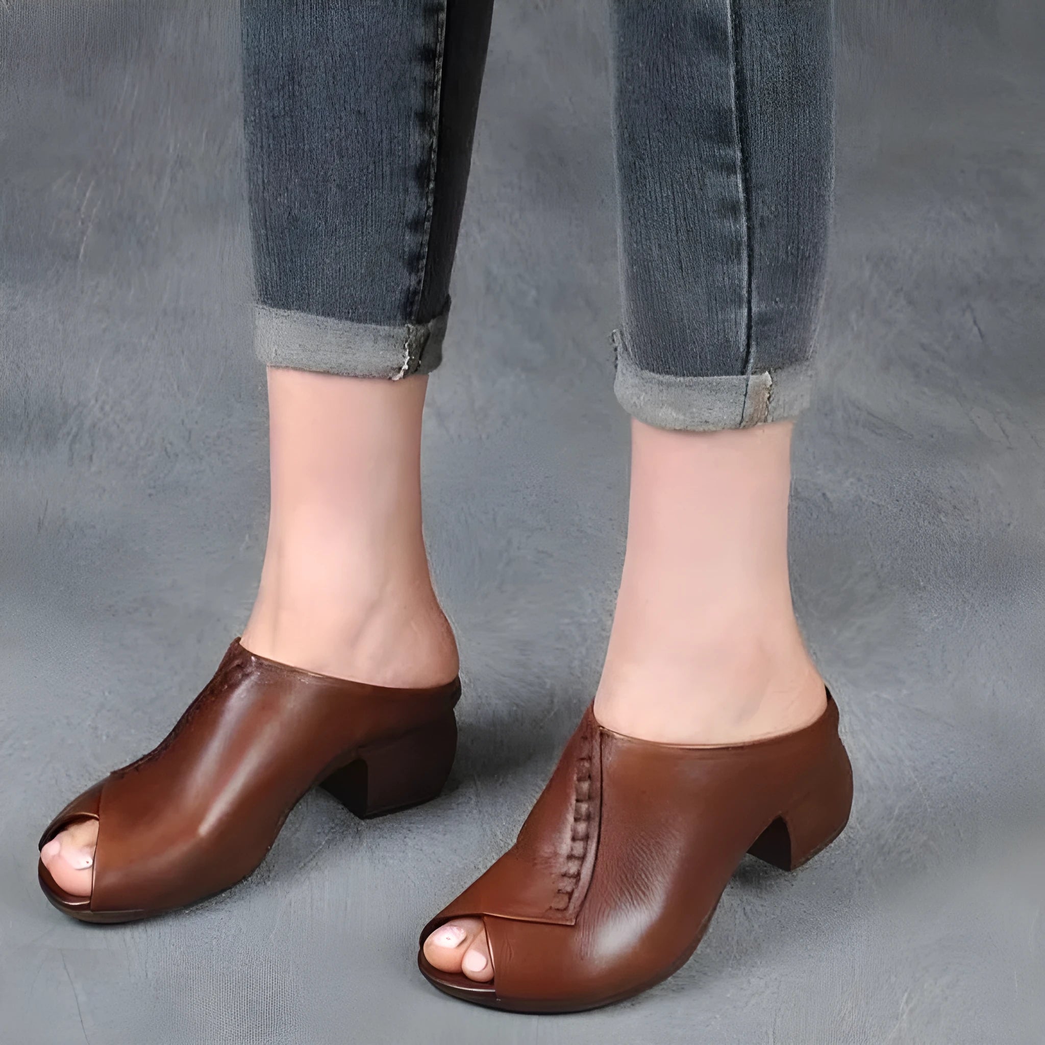 Women's black square heel peep-toe slippers with a fish mouth vamp design on a white background.