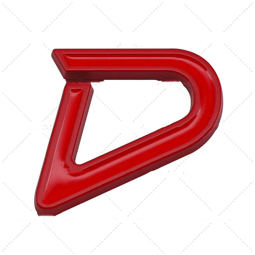 Red and silver SD design metal bumper sticker next to smaller red and black D design, showing scale.