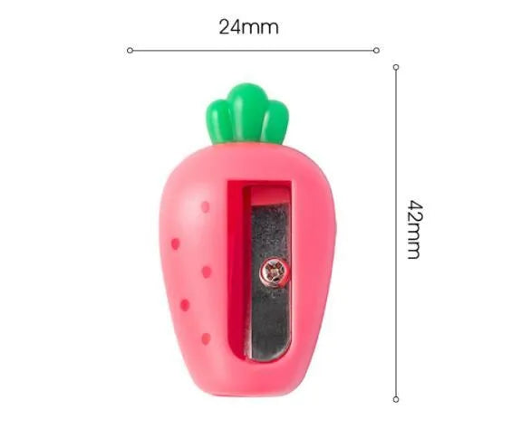 Four fruit and vegetable shaped mini pencil sharpeners in random colours on a light surface