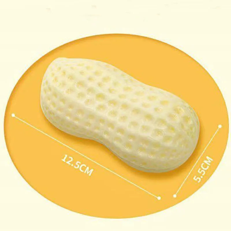 Yellow TPR peanut-shaped dog chew toy with textured surface for teeth cleaning.