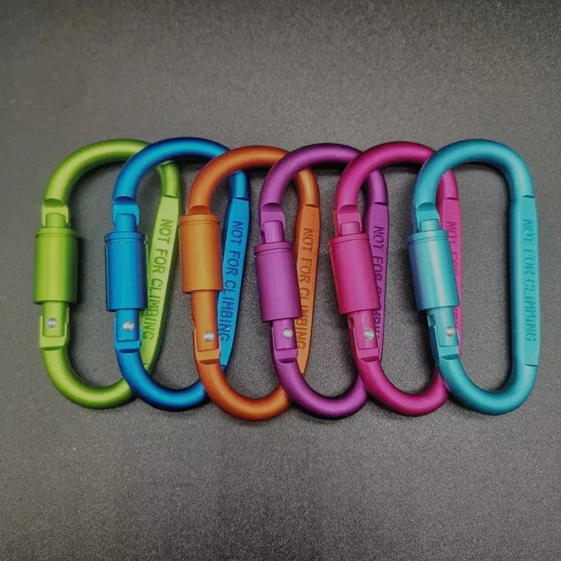 Aluminium D-shaped carabiner with lock in multiple colour options on a grey background.