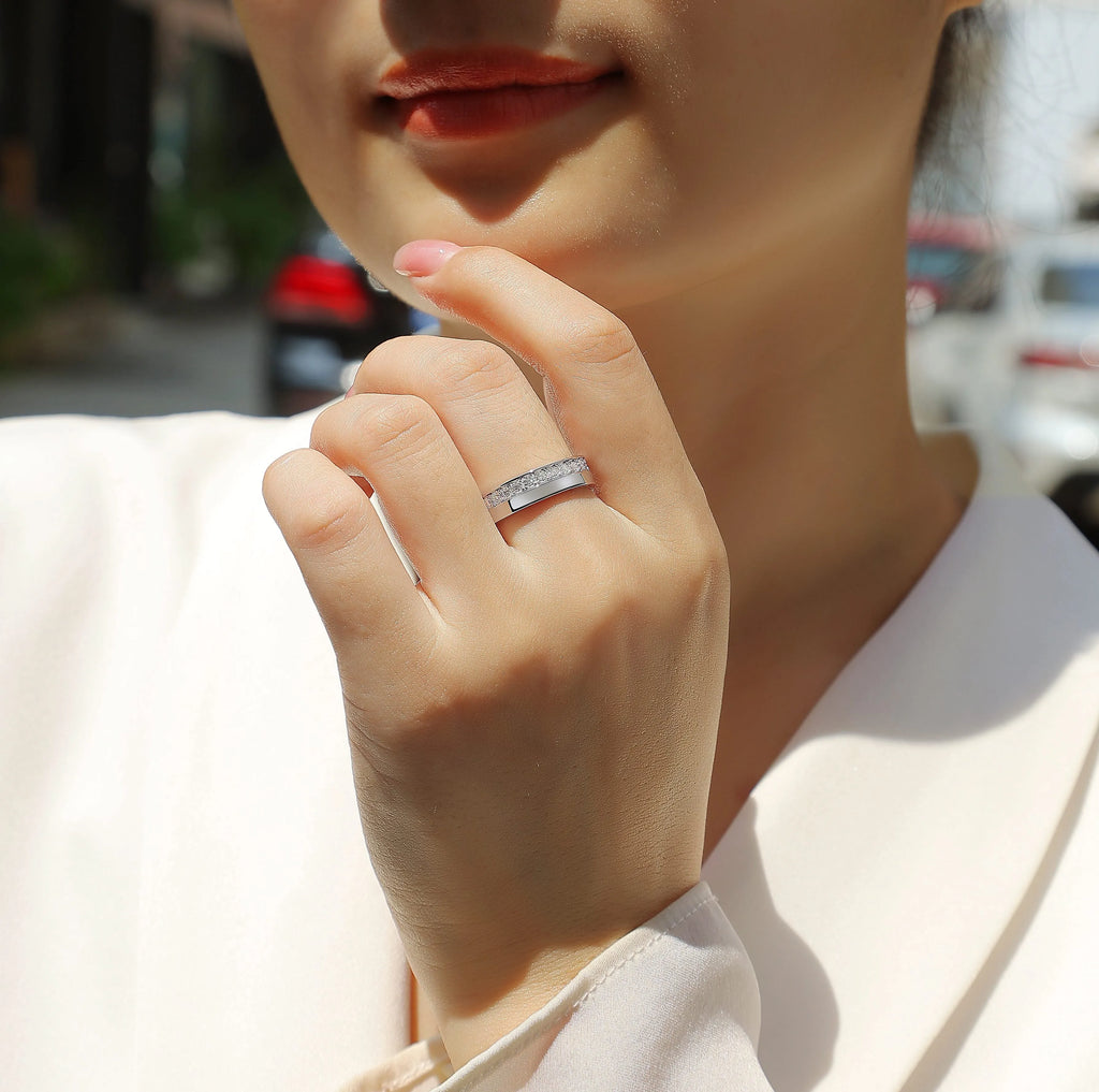 Moissanite wedding ring with gold-plated S925 silver setting on a white background
