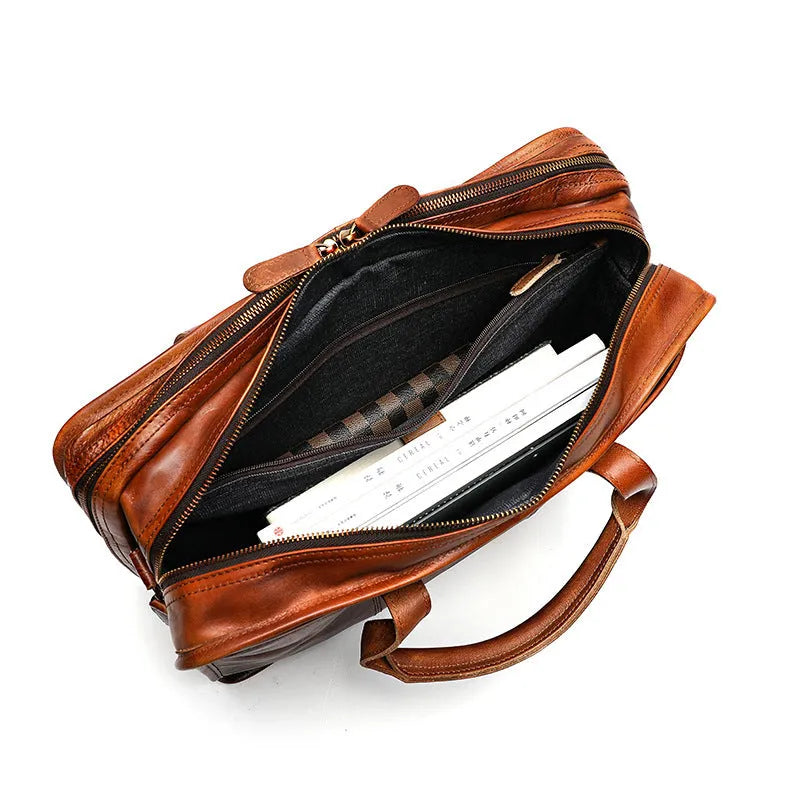 Black top grain cowhide leather men's briefcase showing its horizontal square shape and internal organiser pockets.