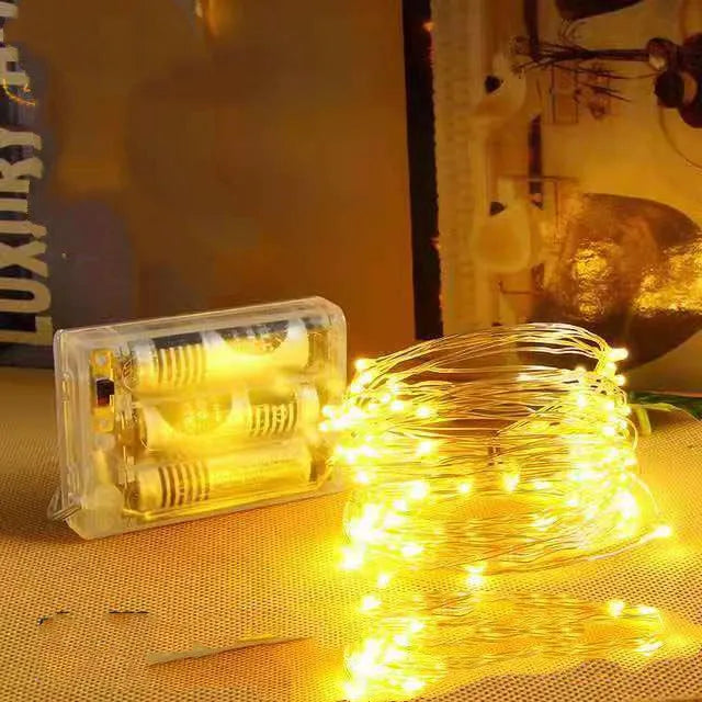 12 metre long copper wire LED string lights in multiple colours, powered by batteries or USB.