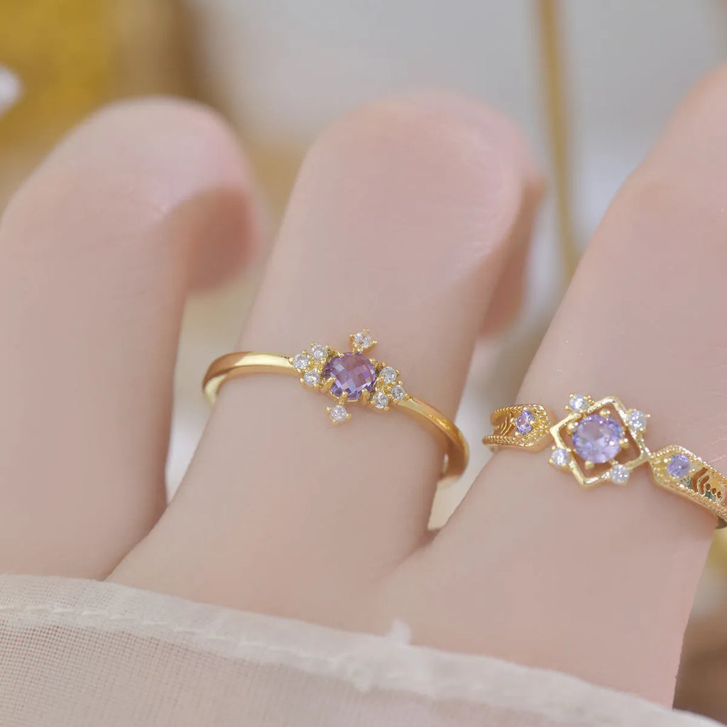 French design copper open mouth ring with purple zircon stones in geometric setting