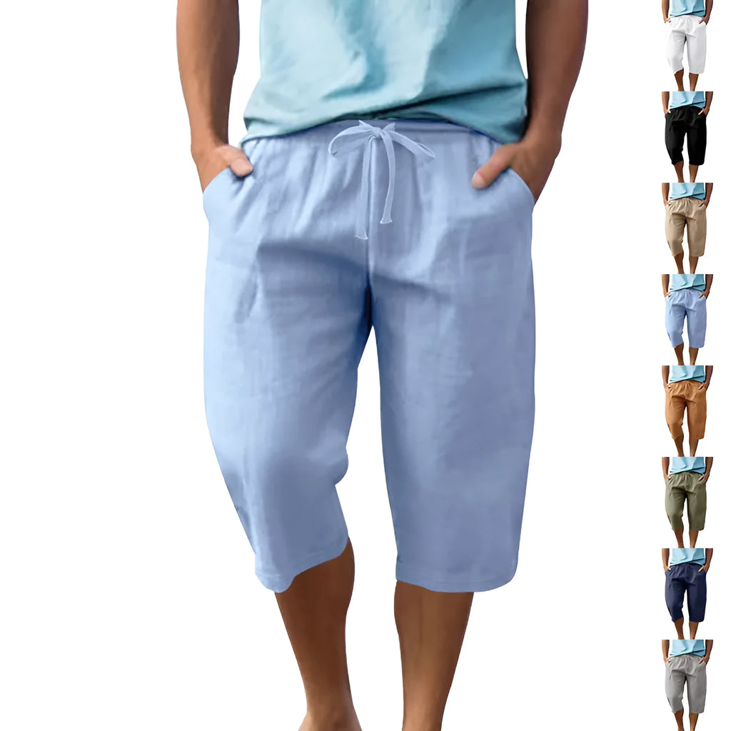 Man wearing loose, high-waisted linen shorts in a solid colour with a drawstring waist.