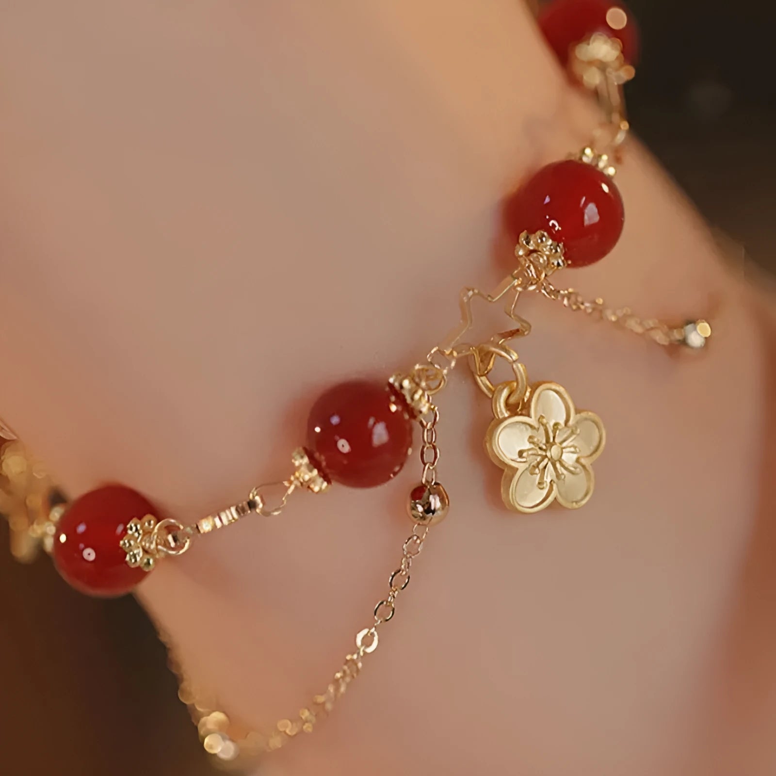 Women's red agate bracelet with double layer design and peach blossom floral elements