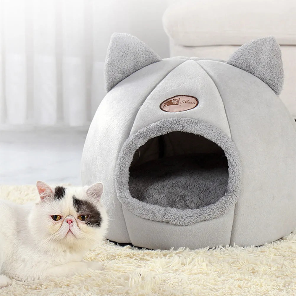 Fully enclosed plush cat winter nest sofa bed with removable cushion, shown in grey