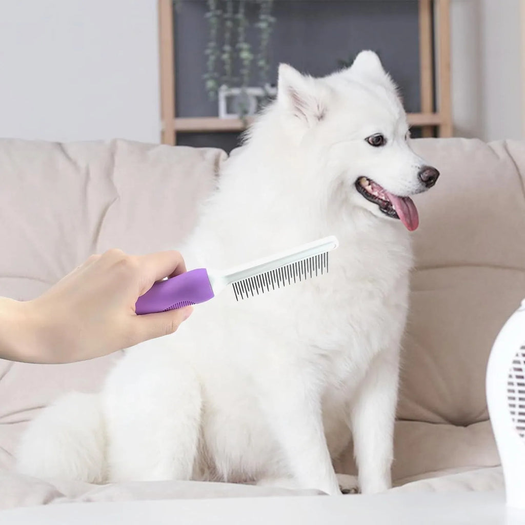 Purple pet detangling comb with stainless steel teeth on a wooden table.