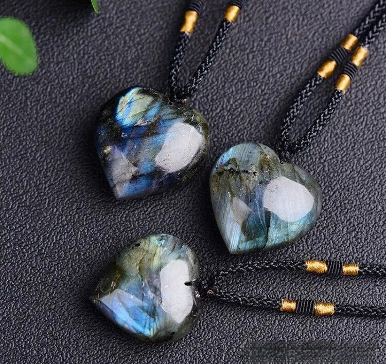Blue light natural crystal heart pendant necklace on a silver chain, showing size options.