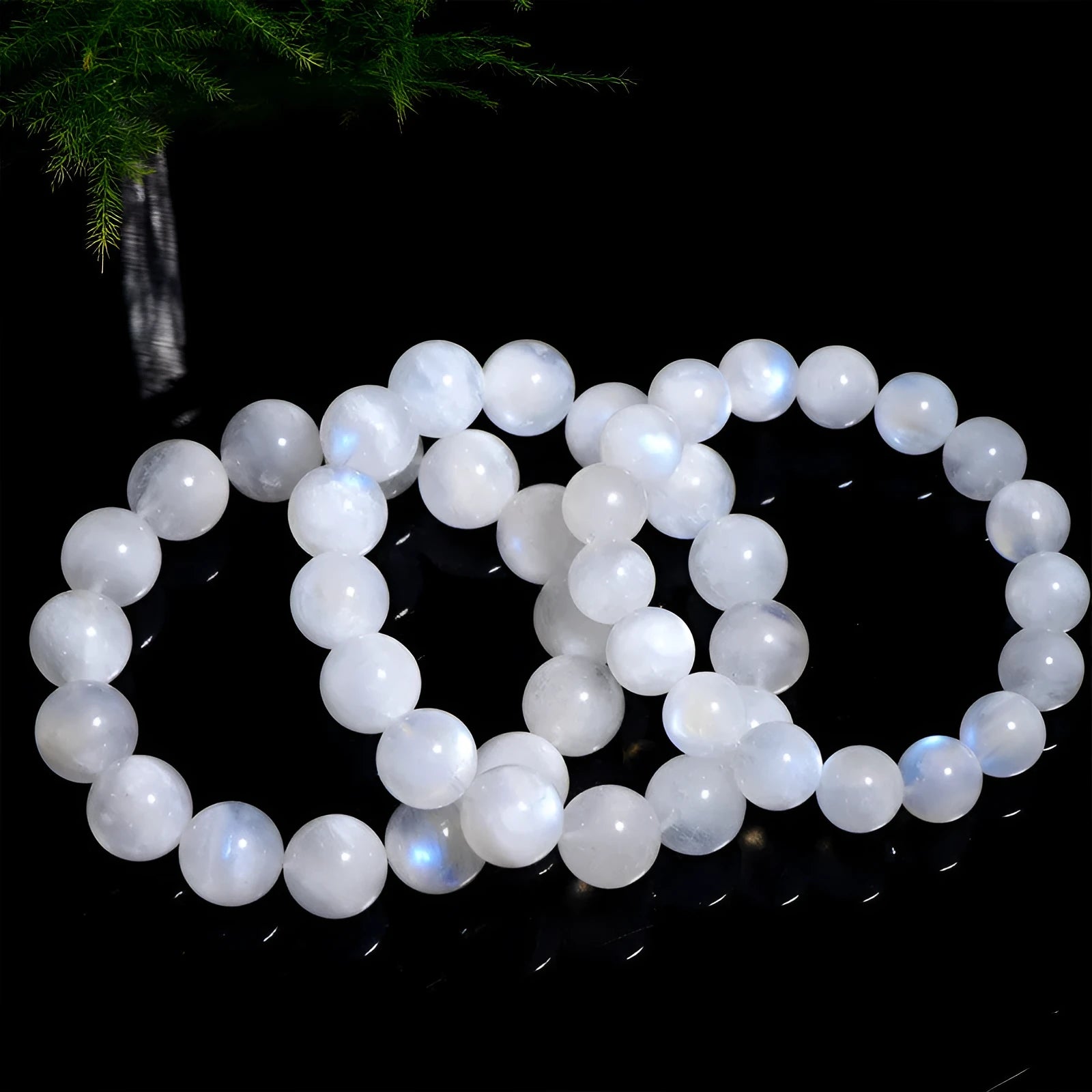 Natural blue moonstone round beads strung on a white cord bracelet.