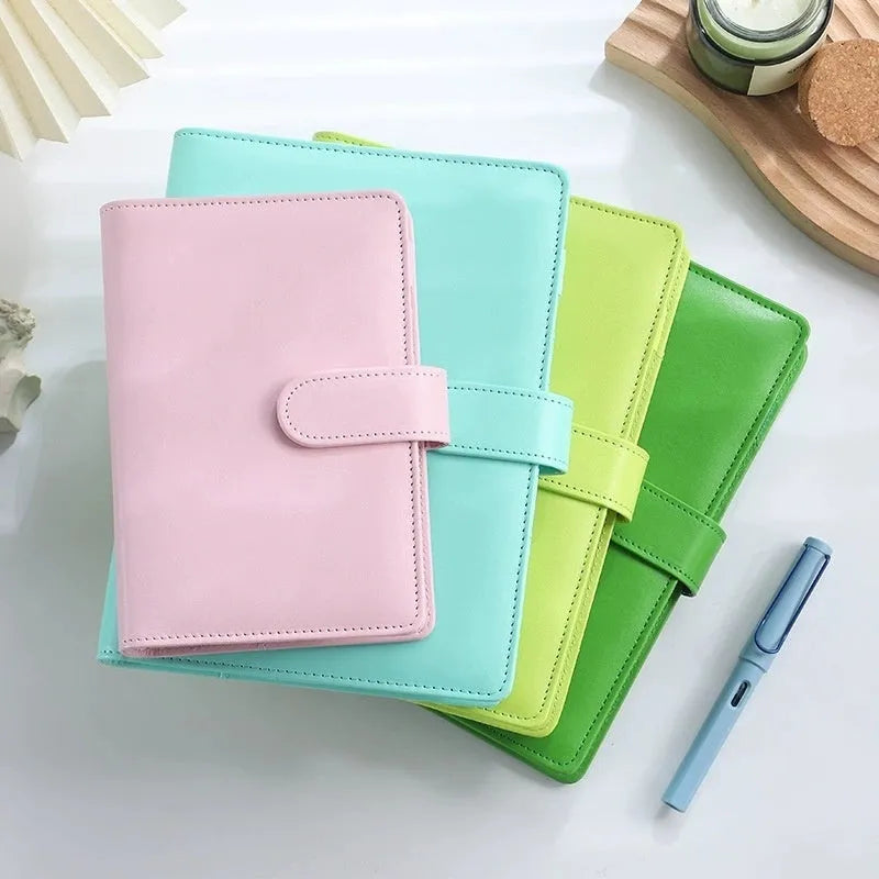 A5 PU leather zipper binder notebook shell shown in multiple solid colours including pink, blue, and black.
