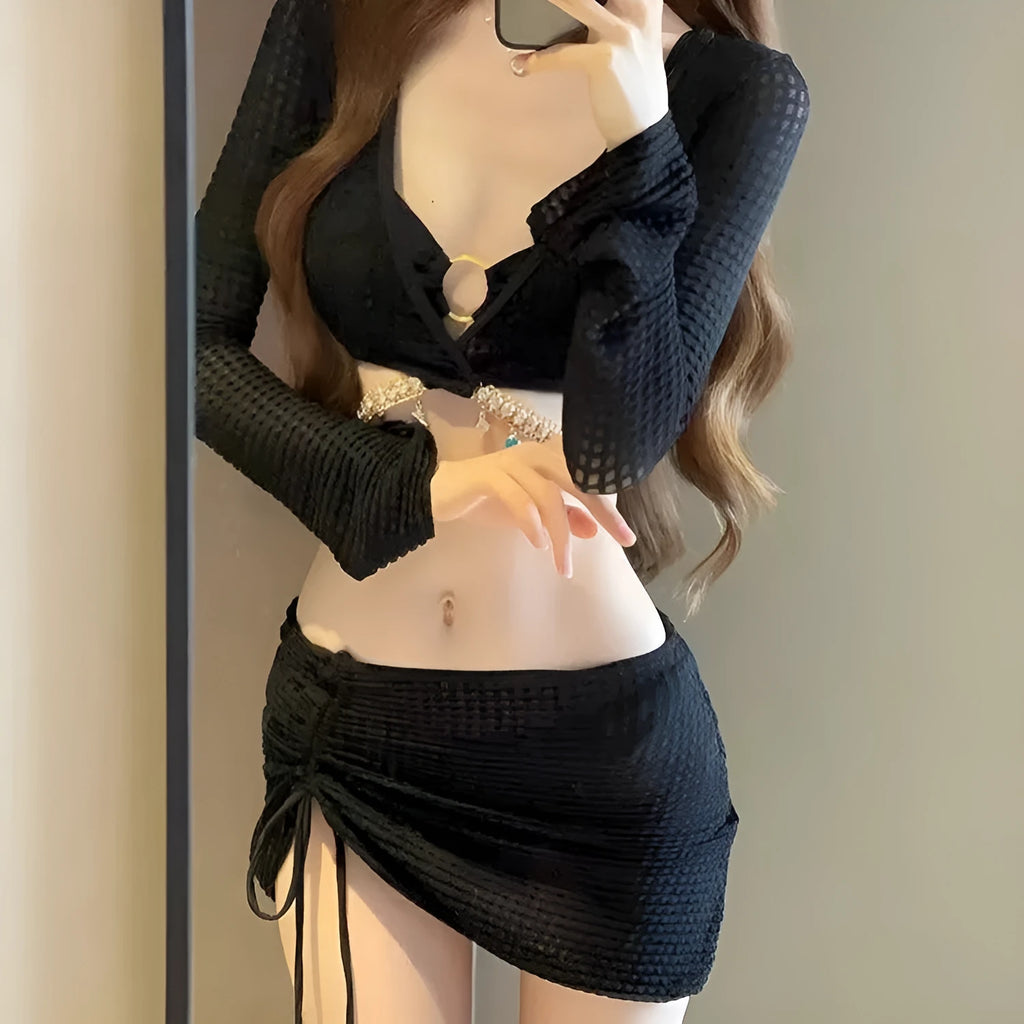 Women's long sleeve black and white bikini swimsuit made from polyester fabric