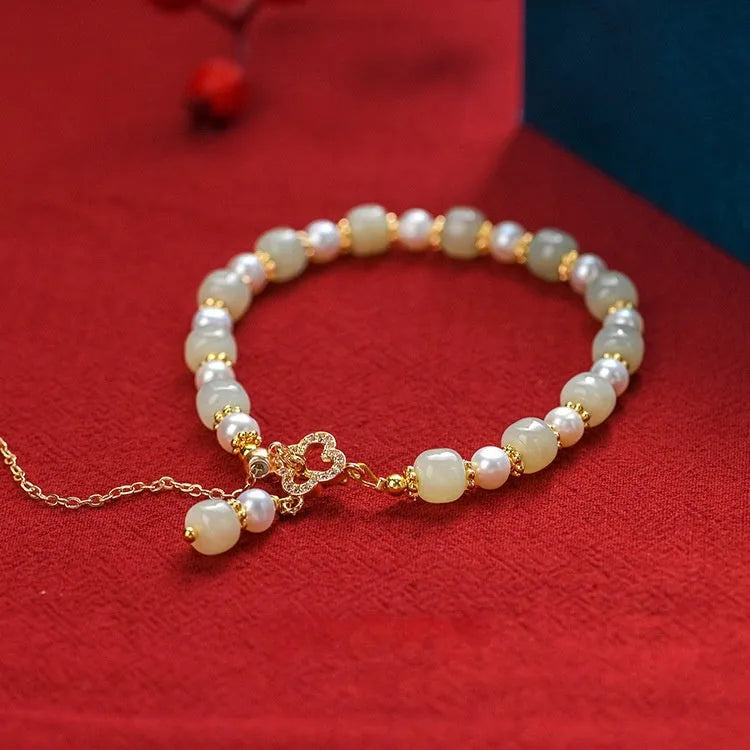 Women's Hetian jade bracelet with pearl pendant and electroplated gold alloy metal in Chinese style