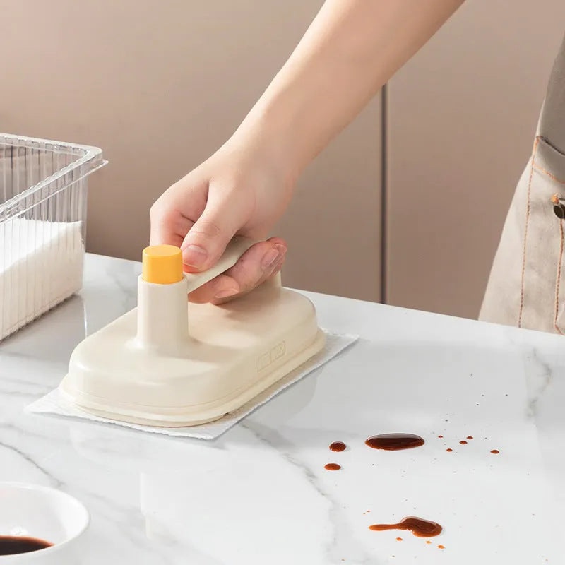 Magic Brush disposable cleaning tool with plastic handle, storage box, and 50 white non-woven fabric rag refills.