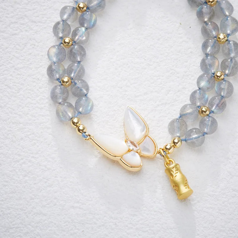 Grey moonstone woven bracelet for women with geometric design and butterfly detailing