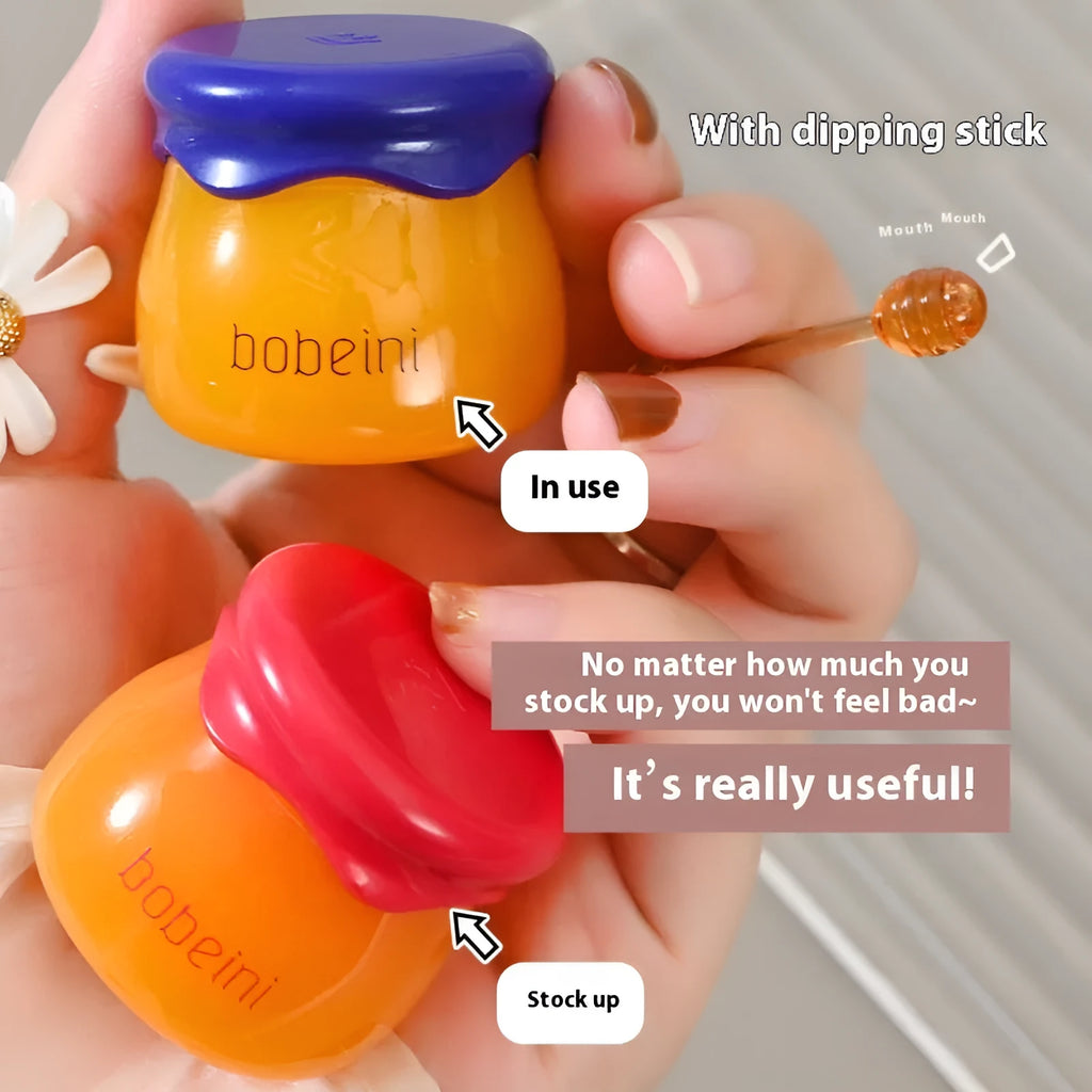 Vaseline Moisturising Lip Balm pot in blueberry or pomegranate flavour, 9g net content with applicator brush.