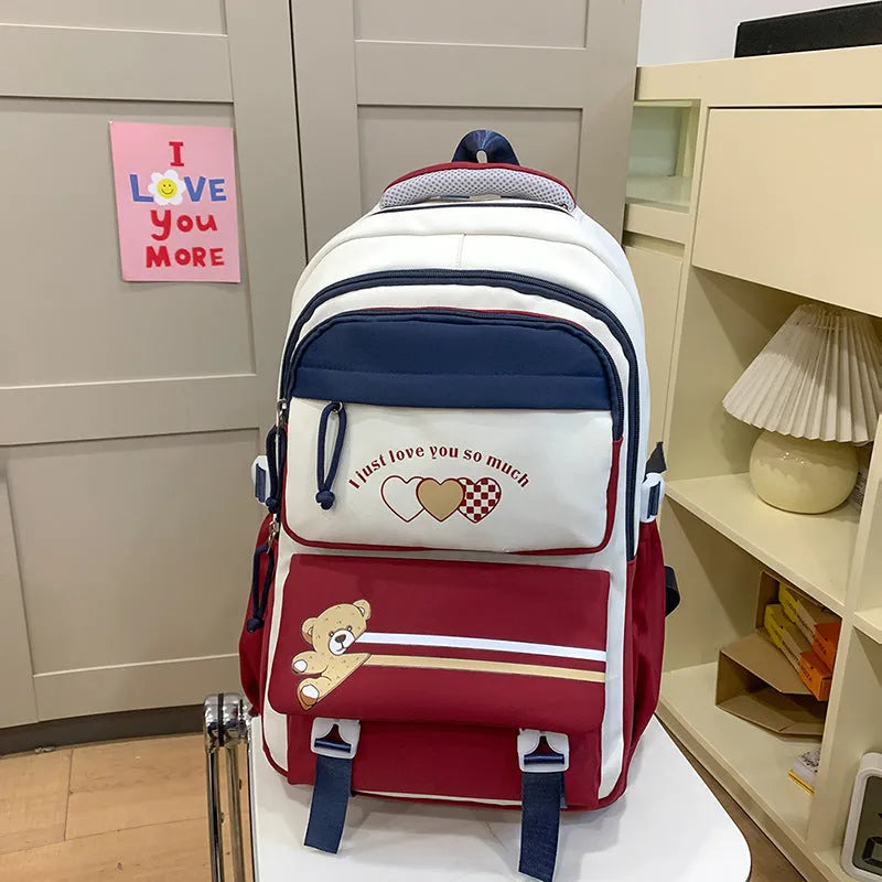 Nylon burden alleviation backpack for girls in pink long leg cloud design with outer sandwich pocket and stitching details