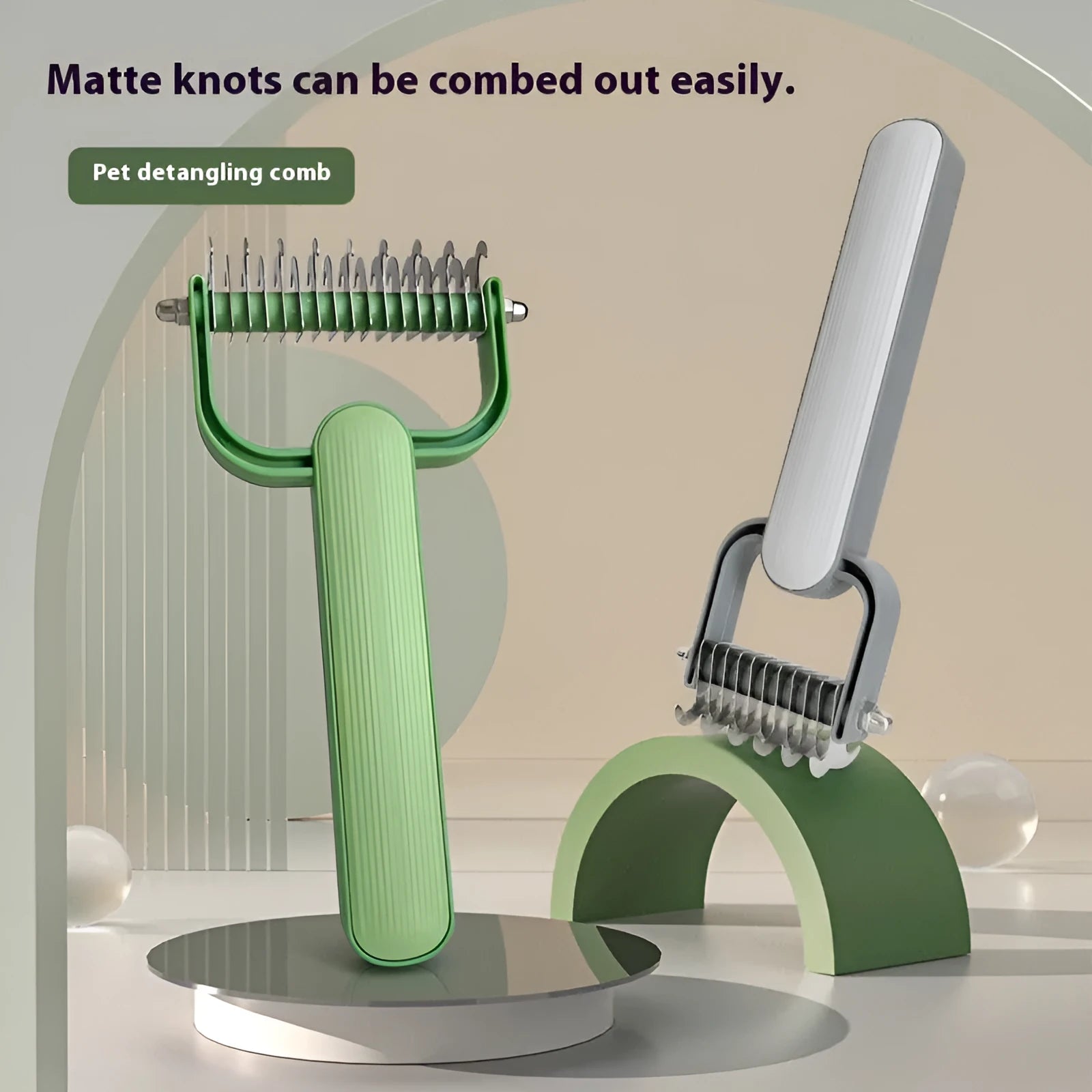 Green and grey pet hair unknotting comb for dogs with stainless steel teeth on a PP plastic handle.