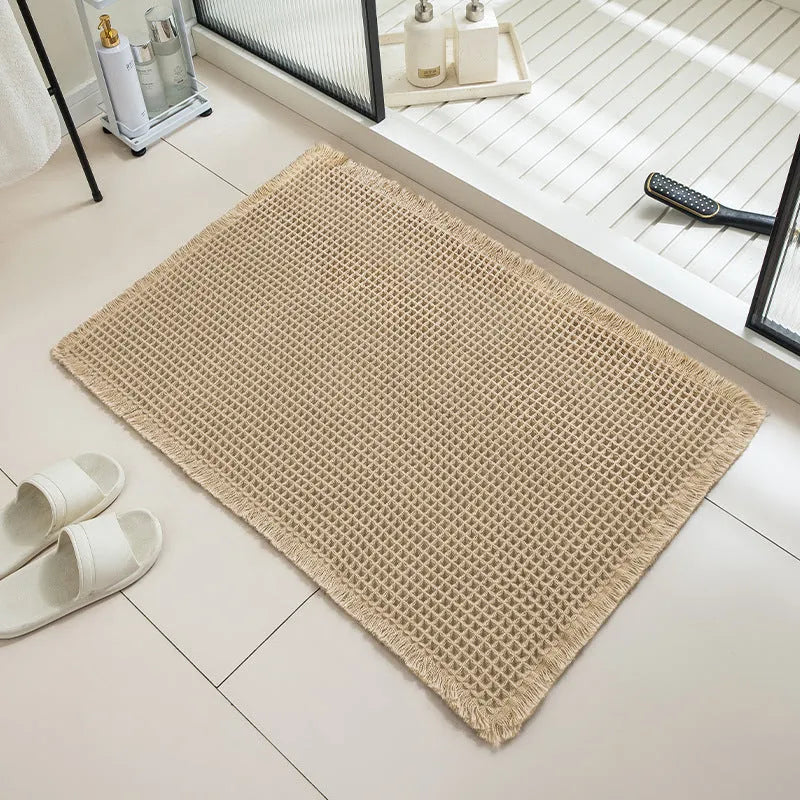 Checkered non-slip bathroom floor carpet in beige, available in multiple sizes from 43x61cm to 61x183cm