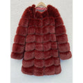 Women's long black artificial fur coat with regular sleeves on a hanger.