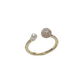 Gold or silver open-end pearl ring with round zircon detailing on a geometric band.