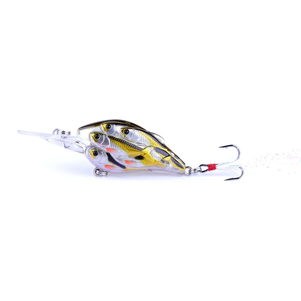Sea fishing hard bait lure with feather hooks floating on water surface