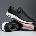 Low top black and white mesh casual shoes with cross shoulder straps and a composite sole.