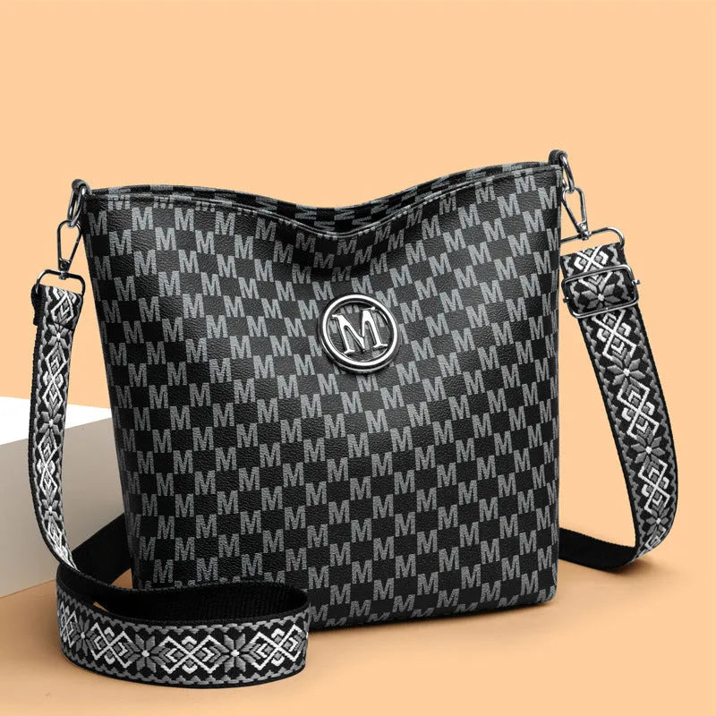 PU leather retro dumpling-shaped shoulder bag in black, brown and white colours with sandwich pocket design