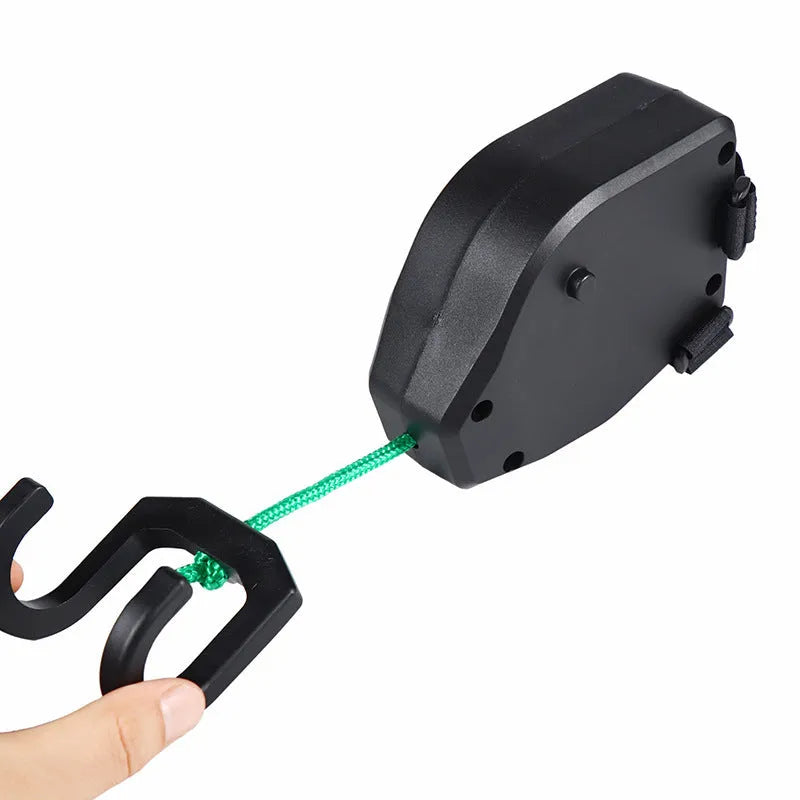 Black plastic resin bicycle trailer rope with hook-and-loop fastening for trailer security