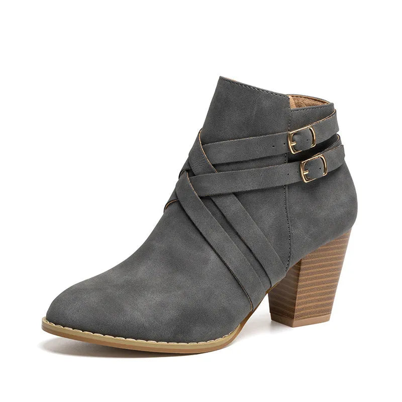 Grey women's plus size ankle boots with a 7cm chunky heel, side zipper, and belt buckle detail.