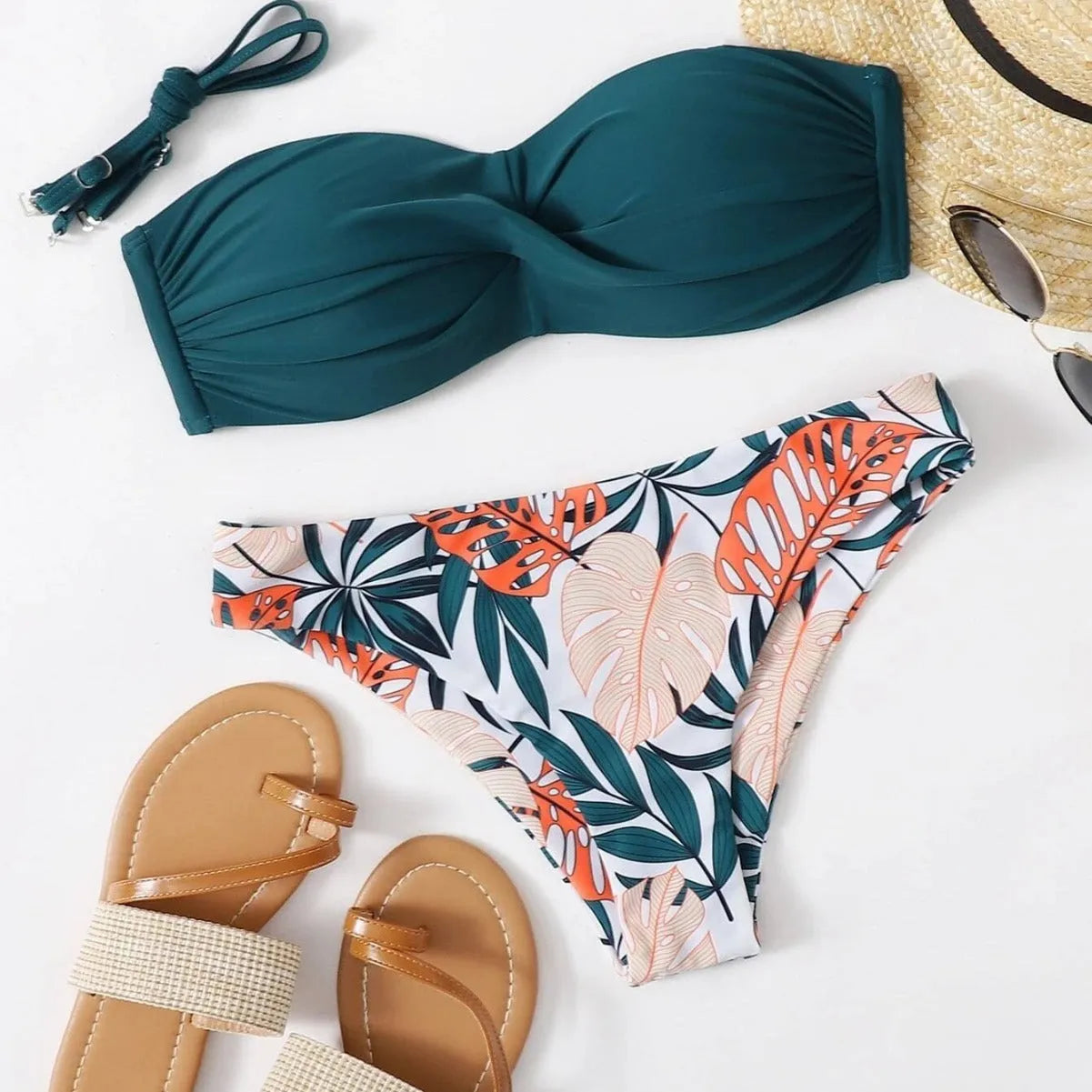 Split push up hard bag bikini swimsuit with matching briefs in multiple colours on a mannequin.