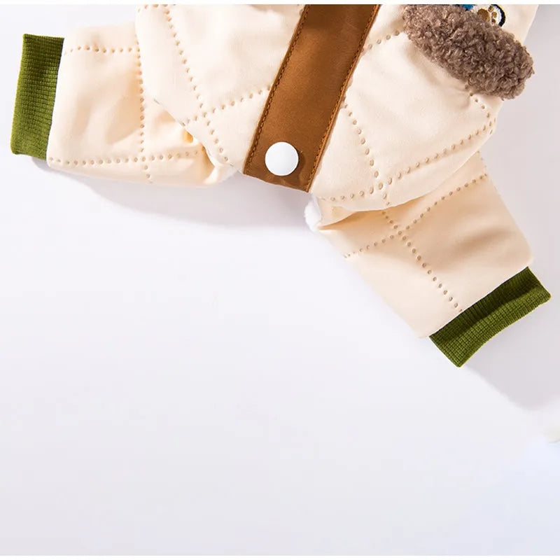 Warm thick Maillard pocket patch four-legged cotton coat for dogs in green, lying on a surface