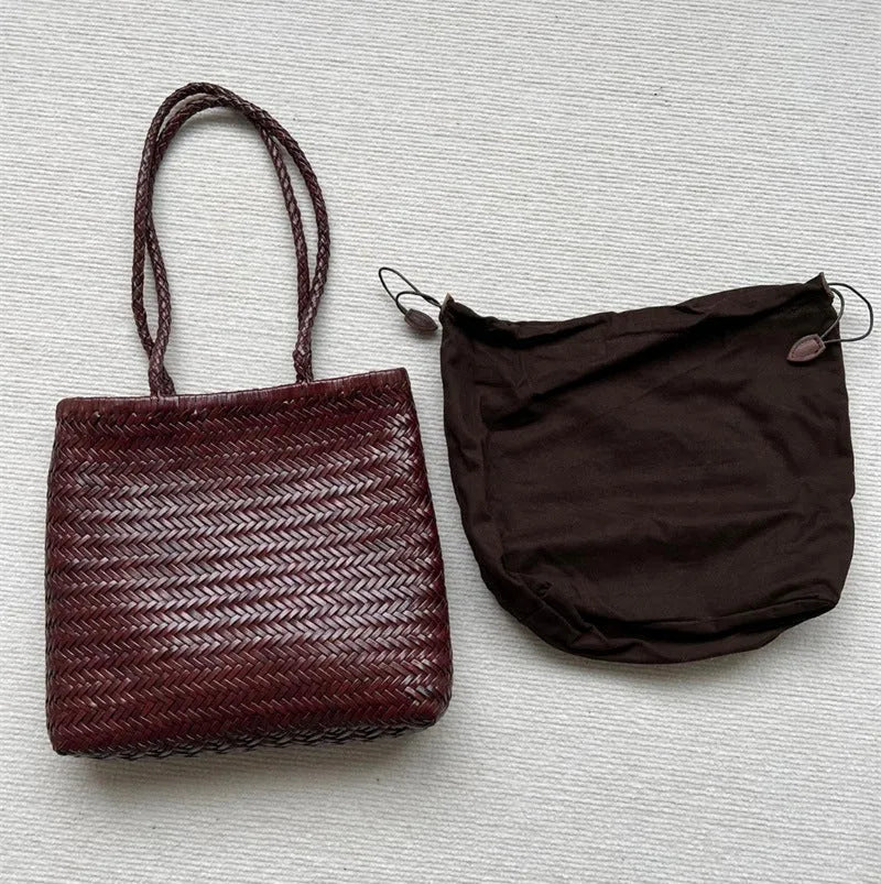 Brown woven genuine cowhide leather tote bag with a front pocket.