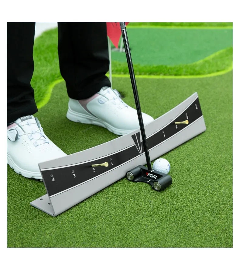 Adjustable golf putter trajectory balance simulator made from white PVC on a green mat.