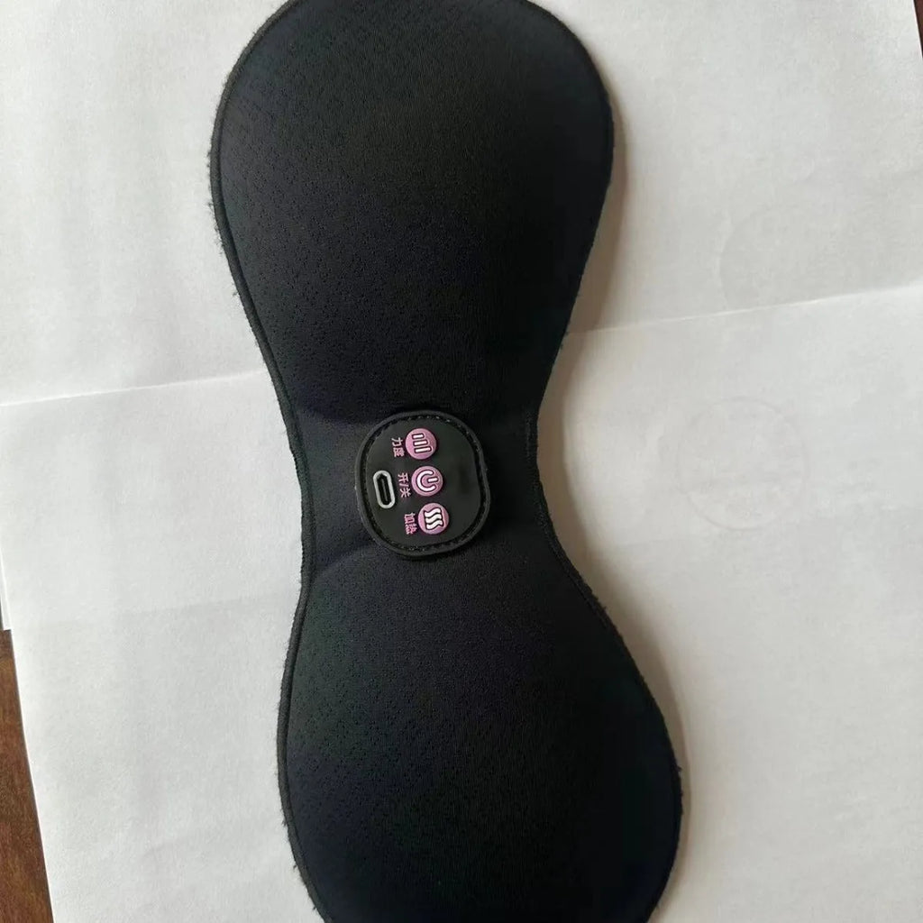 Black electric massage chest pads with adhesive stickers and three-button control panel