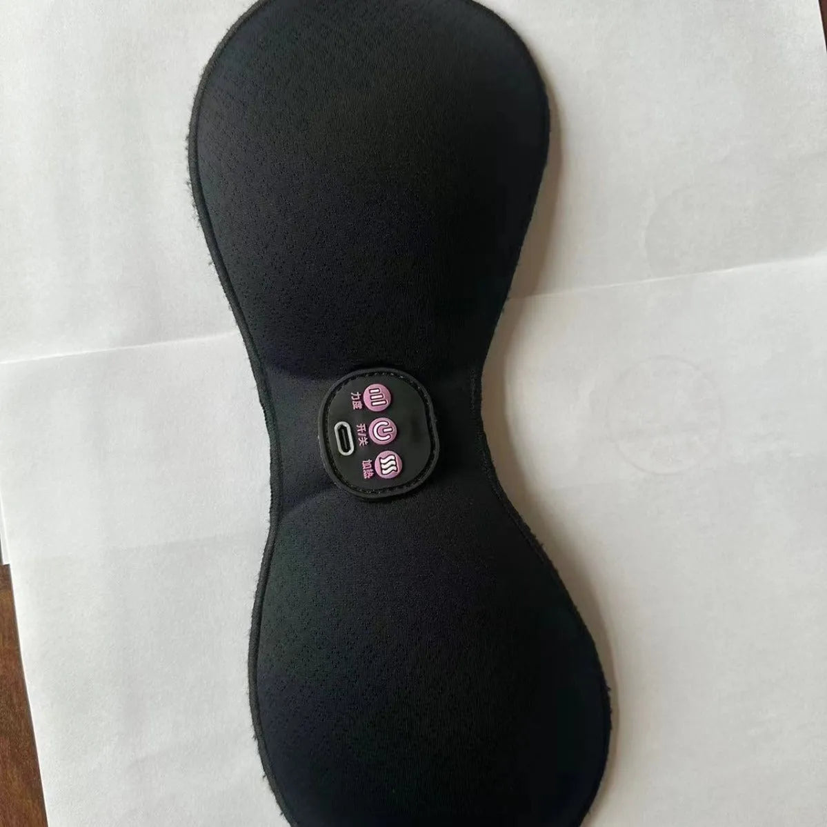 Black electric massage chest pads with adhesive stickers and three-button control panel