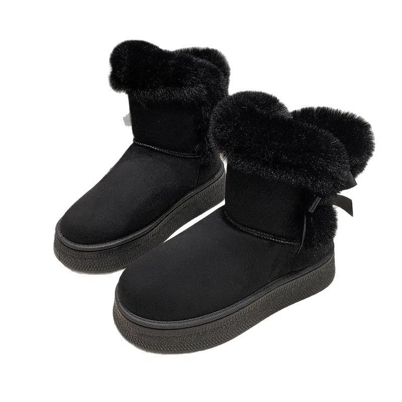 Women's mid-calf suede snow boots with faux fur lining, 1–3 cm thick rubber sole, and bow tie detail, shown in brown, black, or white.