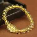 Yellow leather bracelet with an artificial crystal Citrine Pi Xiu charm in national Chinese style.