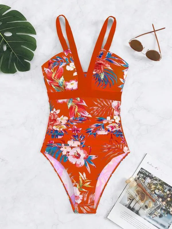 Women's floral print backless one-piece swimsuit on a model, showing the tight fit and stretchy fabric.
