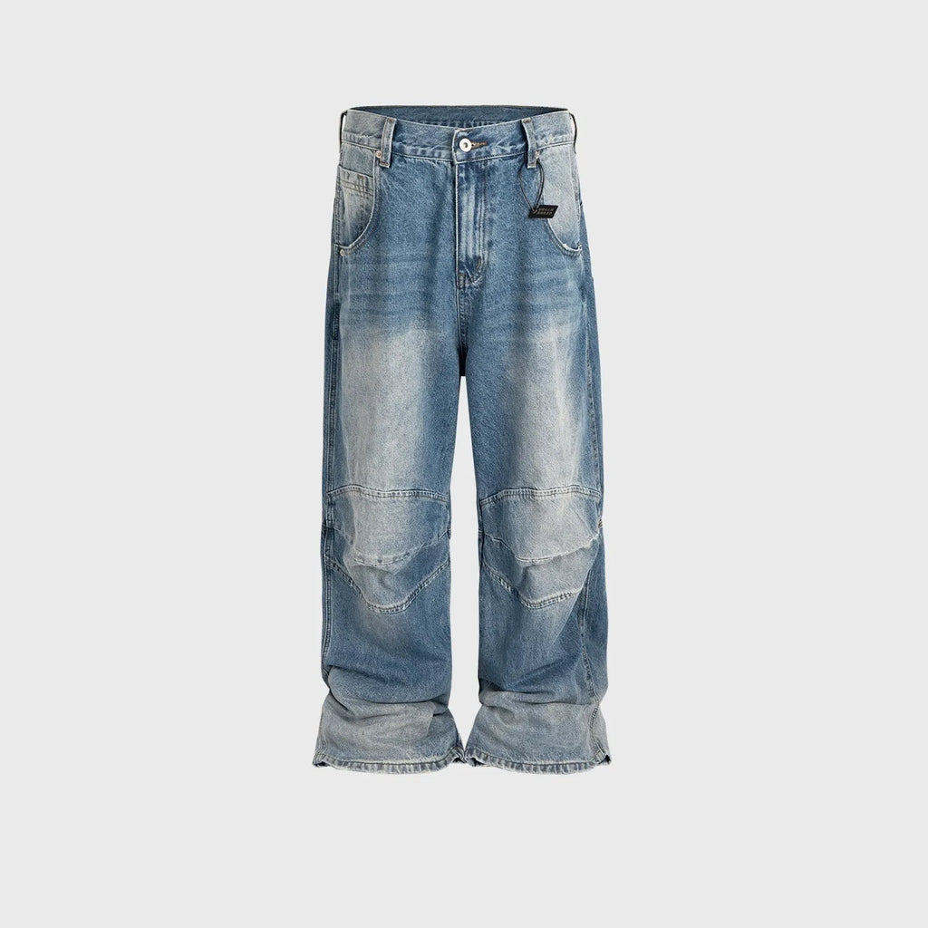 Men's straight leg baggy jeans in a washed blue denim colour with a zip fly.