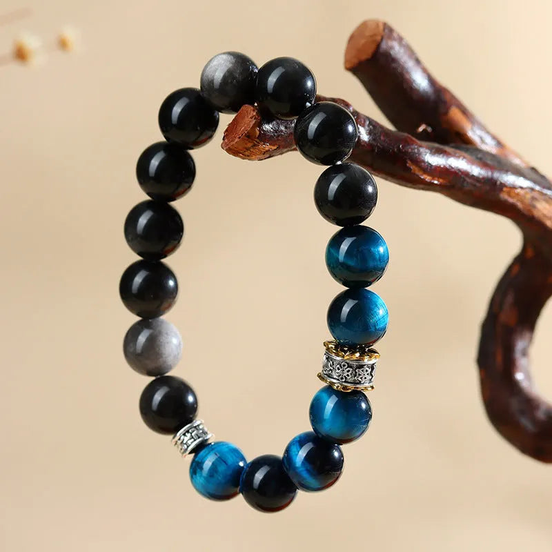 Handmade peacock blue Tigereye stone bracelet with geometric round beads and silver-coloured settings
