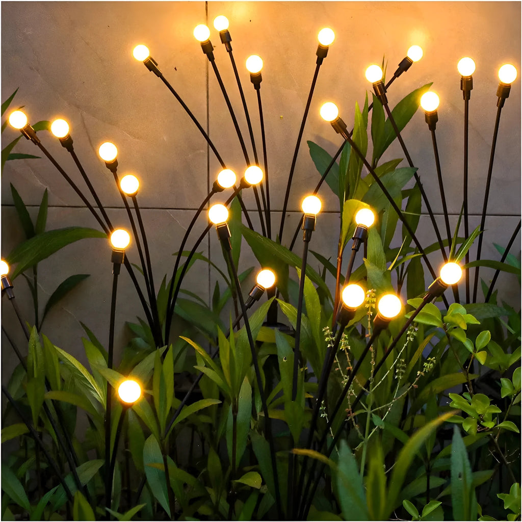 Solar-powered garden lamp with automatic light sensor and ground stake, showing warm white and coloured LED options.